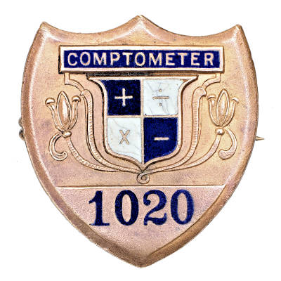 Comptometer workers' badge.